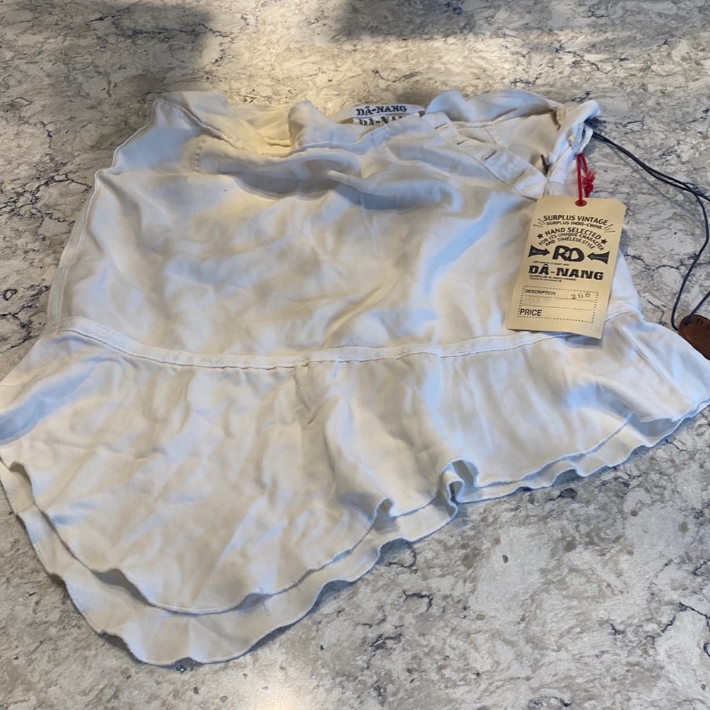 Da Nang skirt.   Size XS.  Two buttons missing although NWT